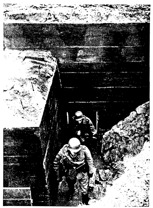 Figure 21.—Machine-gun crew leaving bunker.