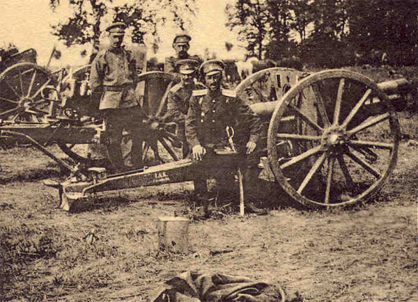 Captain the Baron de Wrangel sitting on one of the field guns taken from the Germans on August 6/19lh., 1914